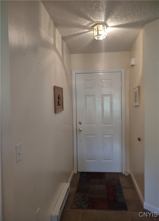 407 Fultz Dr, Oneida-Inside, NY 13421 - entryway featuring a textured ceiling and baseboard heating