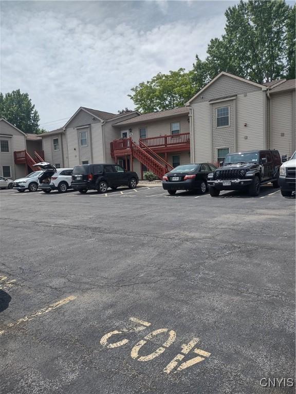 407 Fultz Dr, Oneida-Inside, NY 13421 - uncovered parking lot with stairway