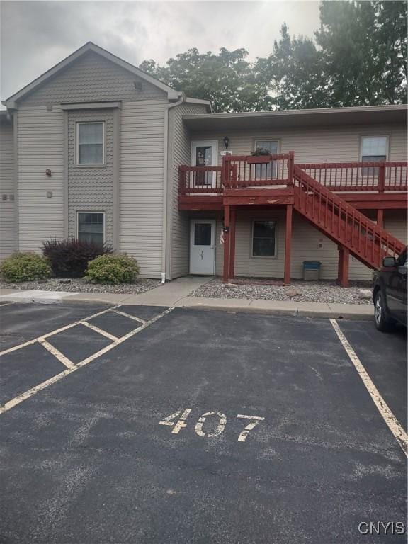 407 Fultz Dr, Oneida-Inside, NY 13421 - view of building exterior with uncovered parking and stairway