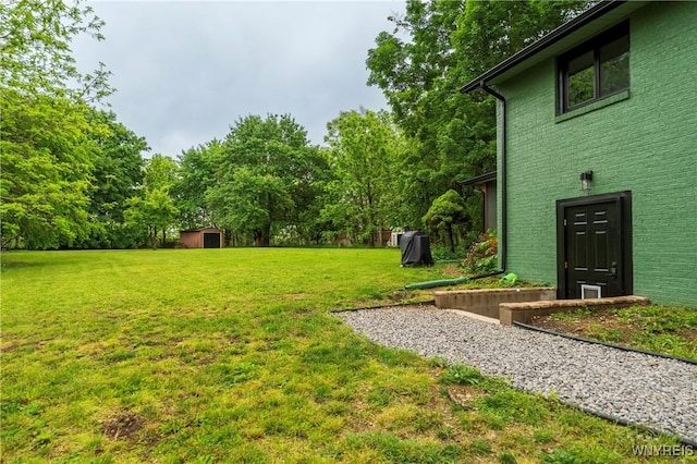 4535 Ransom Rd, Clarence, NY 14031 - view of green lawn featuring a storage shed