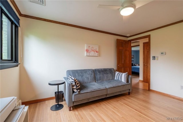 4535 Ransom Rd, Clarence, NY 14031 - living room featuring light wood-style flooring, ceiling fan, and crown molding