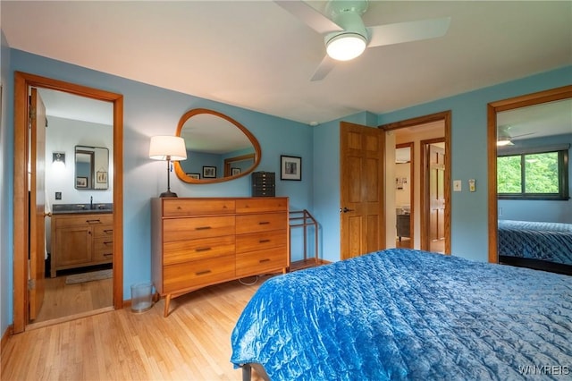 4535 Ransom Rd, Clarence, NY 14031 - bedroom with light wood-style floors, ceiling fan, and ensuite bath