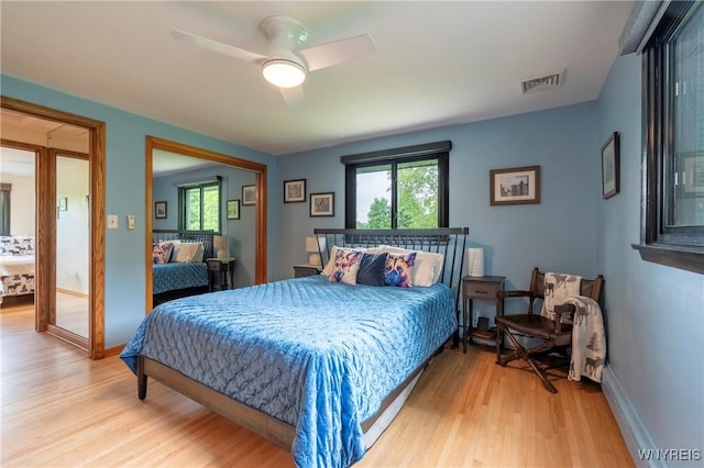 4535 Ransom Rd, Clarence, NY 14031 - bedroom featuring multiple windows, light wood-style floors, ceiling fan, and a closet