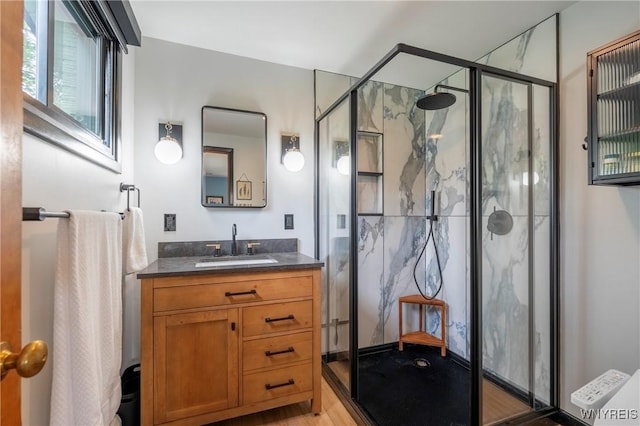 4535 Ransom Rd, Clarence, NY 14031 - bathroom featuring a marble finish shower, vanity, and wood finished floors