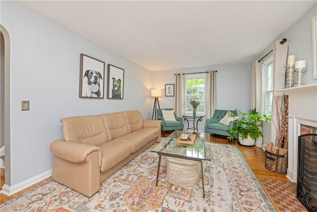 30 Northfield Rd, Irondequoit, NY 14617 - living area featuring wood finished floors, arched walkways, and a fireplace