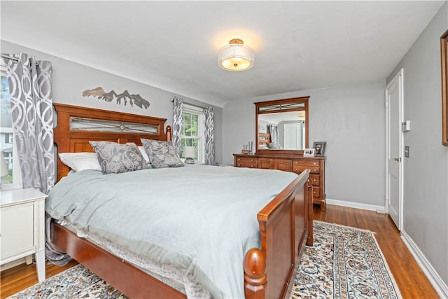 30 Northfield Rd, Irondequoit, NY 14617 - bedroom featuring dark wood-style floors and baseboards