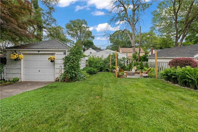 30 Northfield Rd, Irondequoit, NY 14617 - view of yard with a fire pit, driveway, an outdoor structure, and a garage