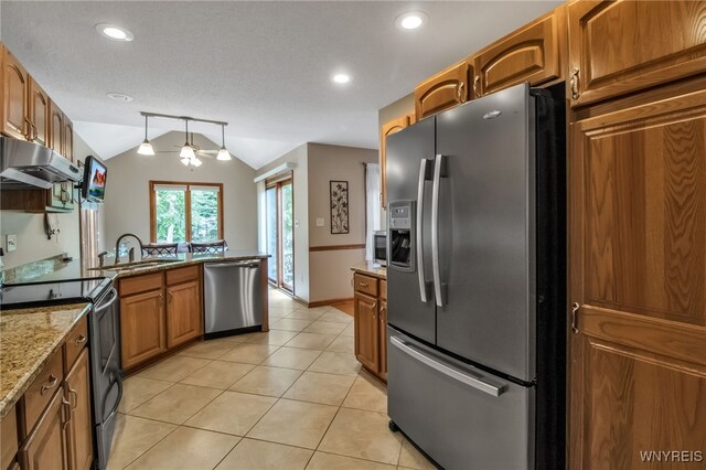 139 Autumn Creek Ct, Amherst, NY 14051 - kitchen featuring stainless steel appliances, ventilation hood, lofted ceiling, brown cabinets, and light tile patterned floors