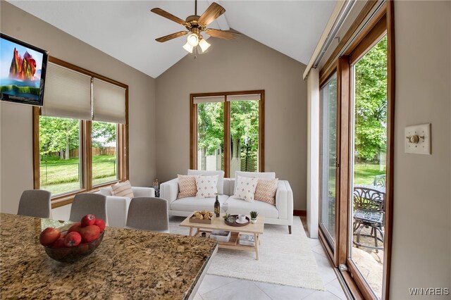 139 Autumn Creek Ct, Amherst, NY 14051 - living area with healthy amount of natural light, light tile patterned floors, a ceiling fan, and lofted ceiling
