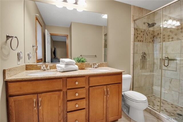 139 Autumn Creek Ct, Amherst, NY 14051 - full bathroom featuring a shower stall, double vanity, and tile patterned flooring