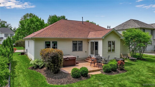 139 Autumn Creek Ct, Amherst, NY 14051 - rear view of property featuring a hot tub, a patio, a yard, and a shingled roof