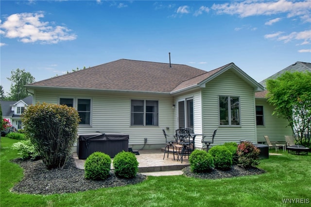 139 Autumn Creek Ct, Amherst, NY 14051 - back of property featuring a hot tub, a patio area, a yard, and roof with shingles