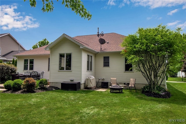 139 Autumn Creek Ct, Amherst, NY 14051 - rear view of house featuring a lawn, an outdoor fire pit, and roof with shingles