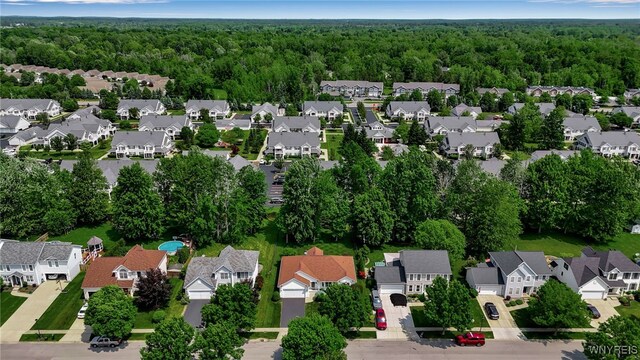139 Autumn Creek Ct, Amherst, NY 14051 - aerial perspective of suburban area with a heavily wooded area