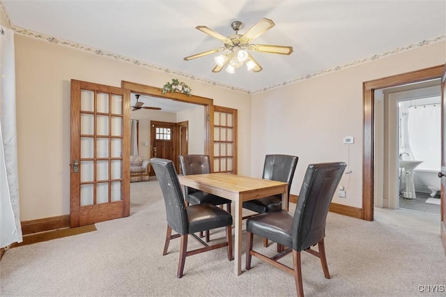 344 S Collingwood Ave, Syracuse, NY 13206 - dining space featuring light carpet, a ceiling fan, and french doors
