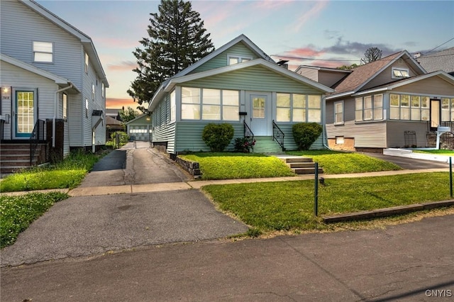 344 S Collingwood Ave, Syracuse, NY 13206 - view of front of home with a garage, a front lawn, and entry steps