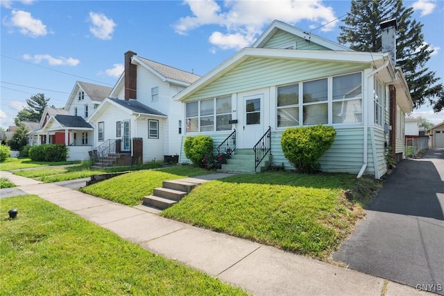 344 S Collingwood Ave, Syracuse, NY 13206 - bungalow with a chimney, entry steps, and a front yard