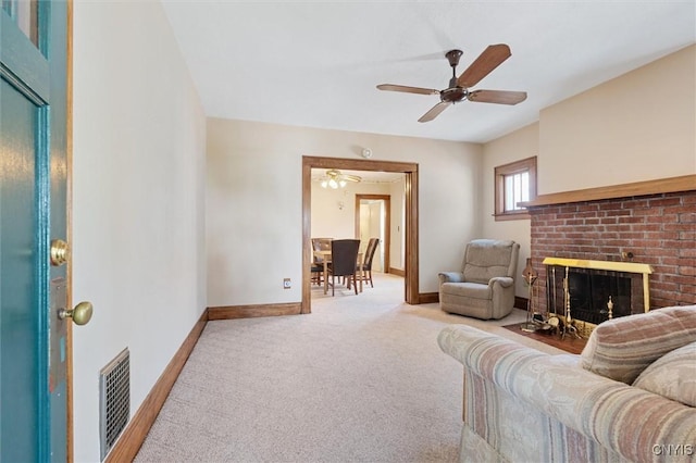 344 S Collingwood Ave, Syracuse, NY 13206 - carpeted living area with a brick fireplace and a ceiling fan