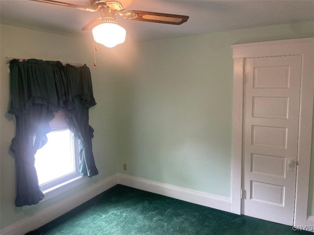 205 Morton St, Syracuse, NY 13204 - empty room featuring dark colored carpet and a ceiling fan