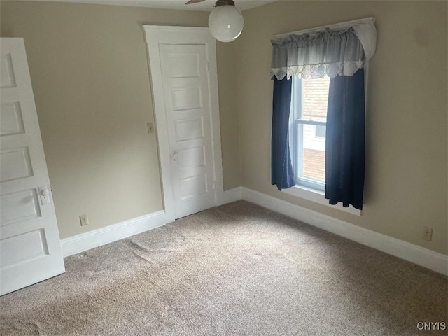 205 Morton St, Syracuse, NY 13204 - carpeted spare room with baseboards and ceiling fan