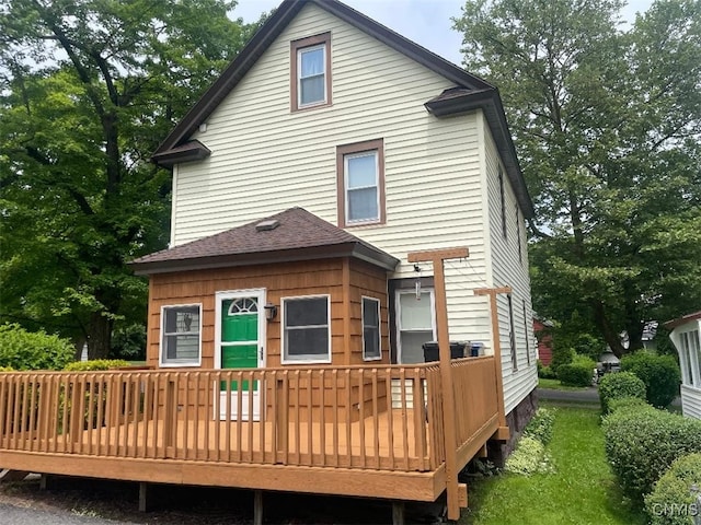 205 Morton St, Syracuse, NY 13204 - back of property with a deck and roof with shingles