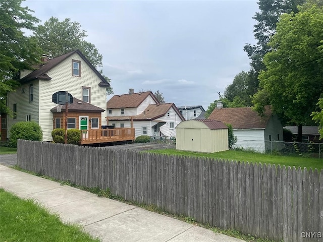 205 Morton St, Syracuse, NY 13204 - view of side of property with a shed and a wooden deck