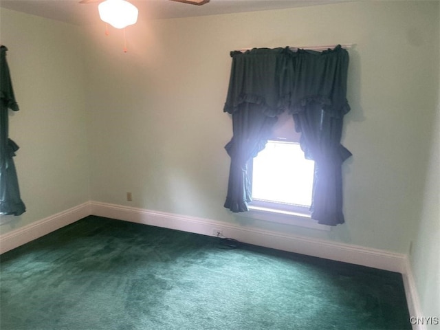 205 Morton St, Syracuse, NY 13204 - carpeted spare room with baseboards and a ceiling fan
