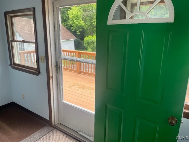 205 Morton St, Syracuse, NY 13204 - doorway to outside featuring baseboards