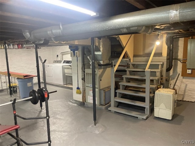 205 Morton St, Syracuse, NY 13204 - unfinished basement featuring washing machine and dryer, stairs, and heating unit