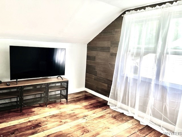 4947 Morgan Pkwy, Hamburg, NY 14075 - bonus room with vaulted ceiling, hardwood / wood-style floors, and wooden walls