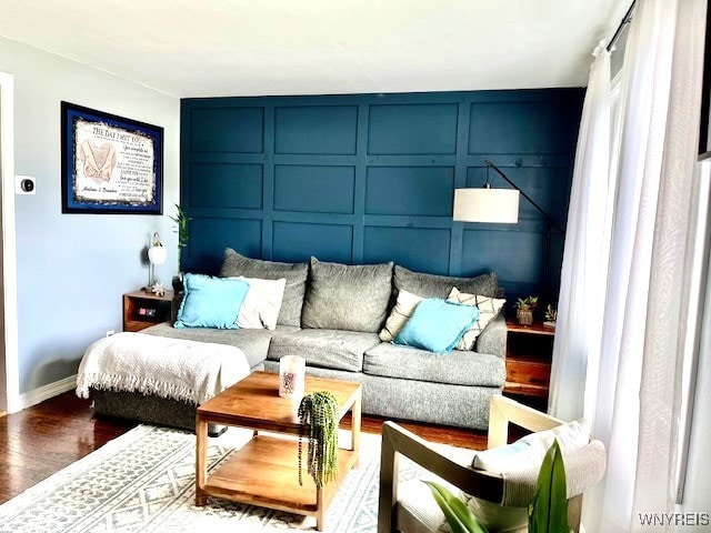 4947 Morgan Pkwy, Hamburg, NY 14075 - living area with a decorative wall and wood finished floors