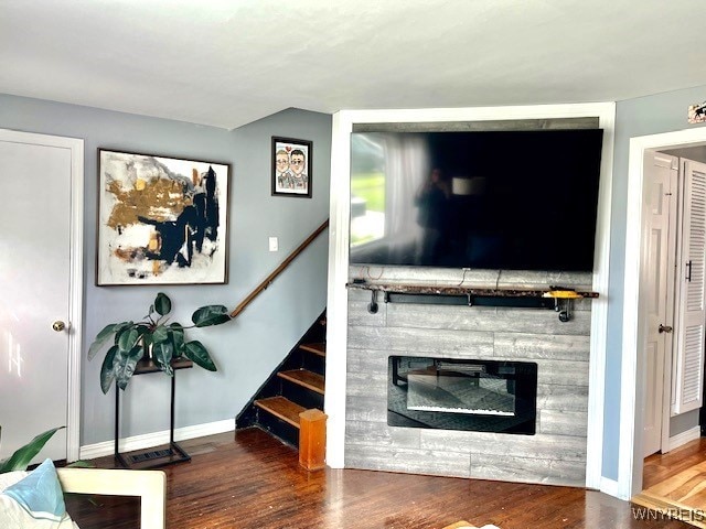 4947 Morgan Pkwy, Hamburg, NY 14075 - living area featuring wood finished floors, stairway, and a glass covered fireplace