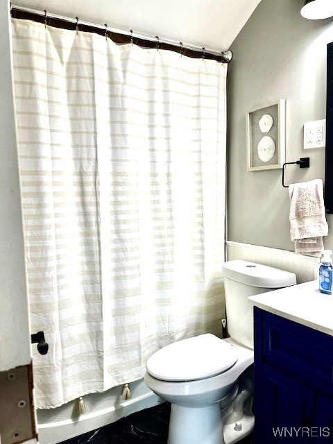 4947 Morgan Pkwy, Hamburg, NY 14075 - bathroom with vanity, wainscoting, and a shower with shower curtain