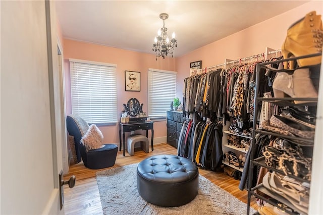 94 Birchwood Dr, Irondequoit, NY 14622 - spacious closet with a chandelier and wood finished floors