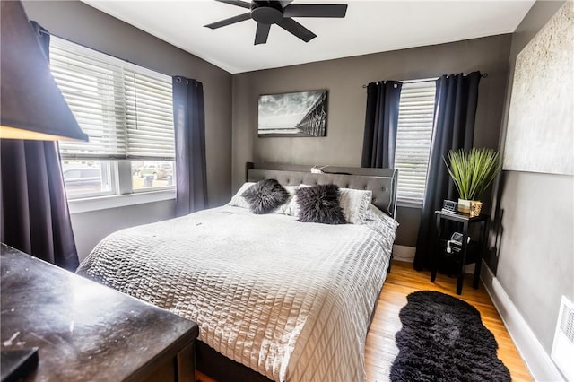 94 Birchwood Dr, Irondequoit, NY 14622 - bedroom featuring wood finished floors and a ceiling fan