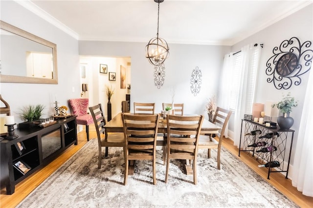 94 Birchwood Dr, Irondequoit, NY 14622 - dining room with light wood finished floors, ornamental molding, and a chandelier