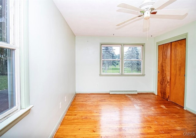 3959 Number Nine Rd, Cazenovia, NY 13035 - empty room with baseboard heating, wood finished floors, and ceiling fan