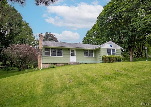3959 Number Nine Rd, Cazenovia, NY 13035 - ranch-style home with a chimney and a front yard