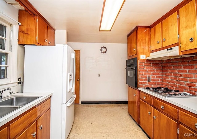 3959 Number Nine Rd, Cazenovia, NY 13035 - kitchen featuring oven, gas stovetop, white refrigerator with ice dispenser, light floors, and brown cabinetry