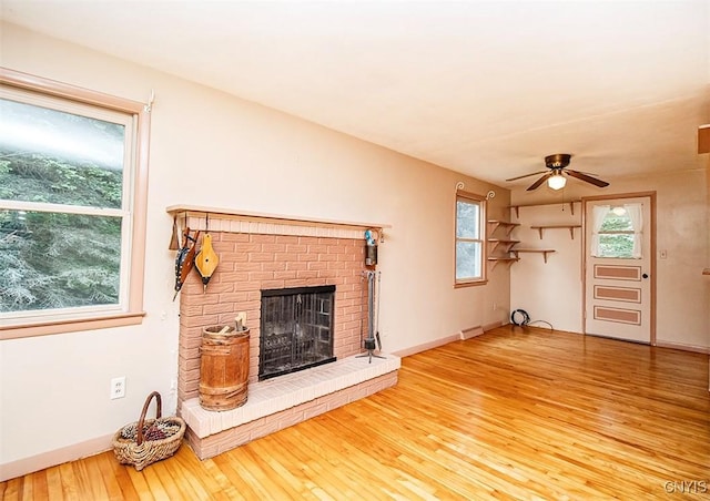 3959 Number Nine Rd, Cazenovia, NY 13035 - unfurnished living room with hardwood / wood-style flooring, a ceiling fan, and a brick fireplace