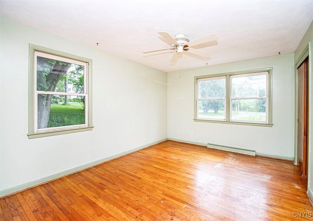 3959 Number Nine Rd, Cazenovia, NY 13035 - unfurnished room featuring plenty of natural light, a baseboard heating unit, light wood-type flooring, and ceiling fan