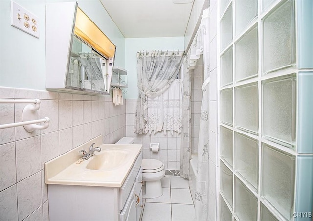 3959 Number Nine Rd, Cazenovia, NY 13035 - bathroom featuring tile walls, tile patterned floors, vanity, shower / tub combo with curtain, and a wainscoted wall