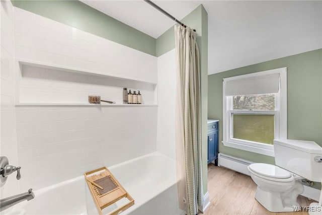 176 Mount Vernon Rd, Amherst, NY 14226 - bathroom with a baseboard heating unit, shower / bath combo with shower curtain, and wood finished floors