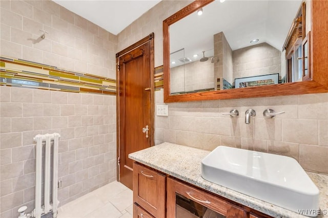 176 Mount Vernon Rd, Amherst, NY 14226 - full bathroom with radiator, tile walls, vanity, a tile shower, and recessed lighting