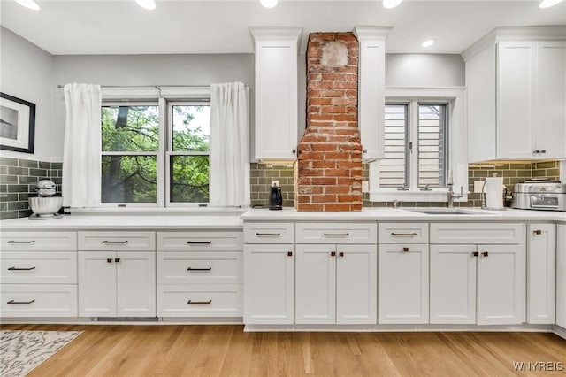 176 Mount Vernon Rd, Amherst, NY 14226 - kitchen featuring white cabinets, plenty of natural light, tasteful backsplash, and recessed lighting