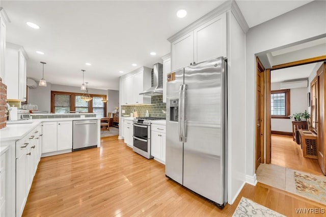 176 Mount Vernon Rd, Amherst, NY 14226 - kitchen with stainless steel appliances, wall chimney range hood, decorative backsplash, plenty of natural light, and recessed lighting