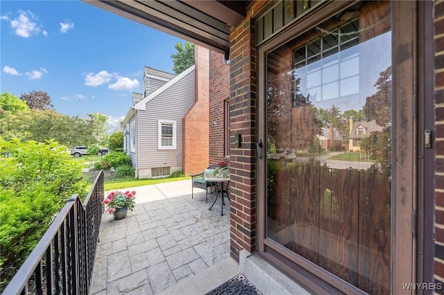 176 Mount Vernon Rd, Amherst, NY 14226 - entrance to property with a patio area and brick siding