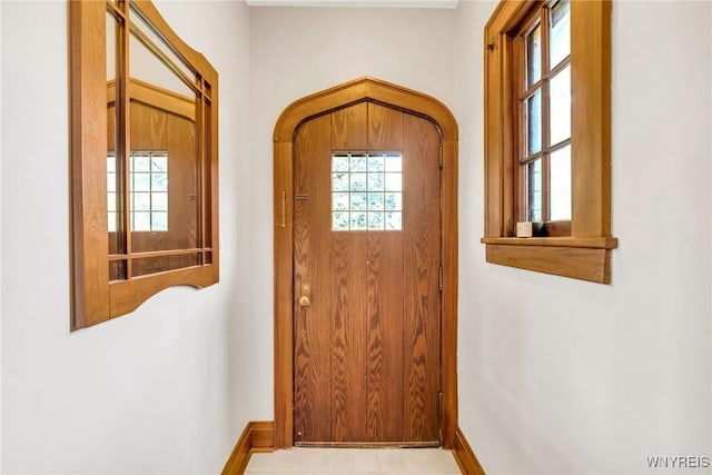 176 Mount Vernon Rd, Amherst, NY 14226 - doorway to outside featuring baseboards
