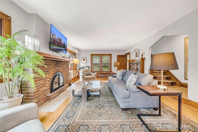 176 Mount Vernon Rd, Amherst, NY 14226 - living room with wood finished floors and a brick fireplace