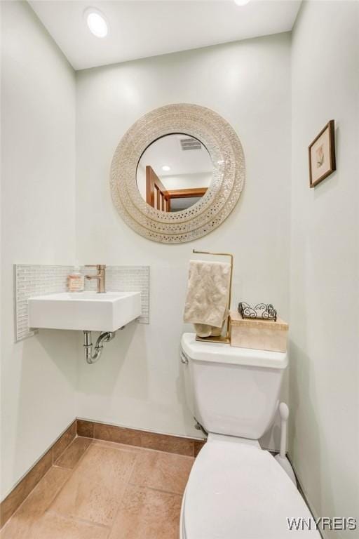 176 Mount Vernon Rd, Amherst, NY 14226 - bathroom featuring a sink and baseboards